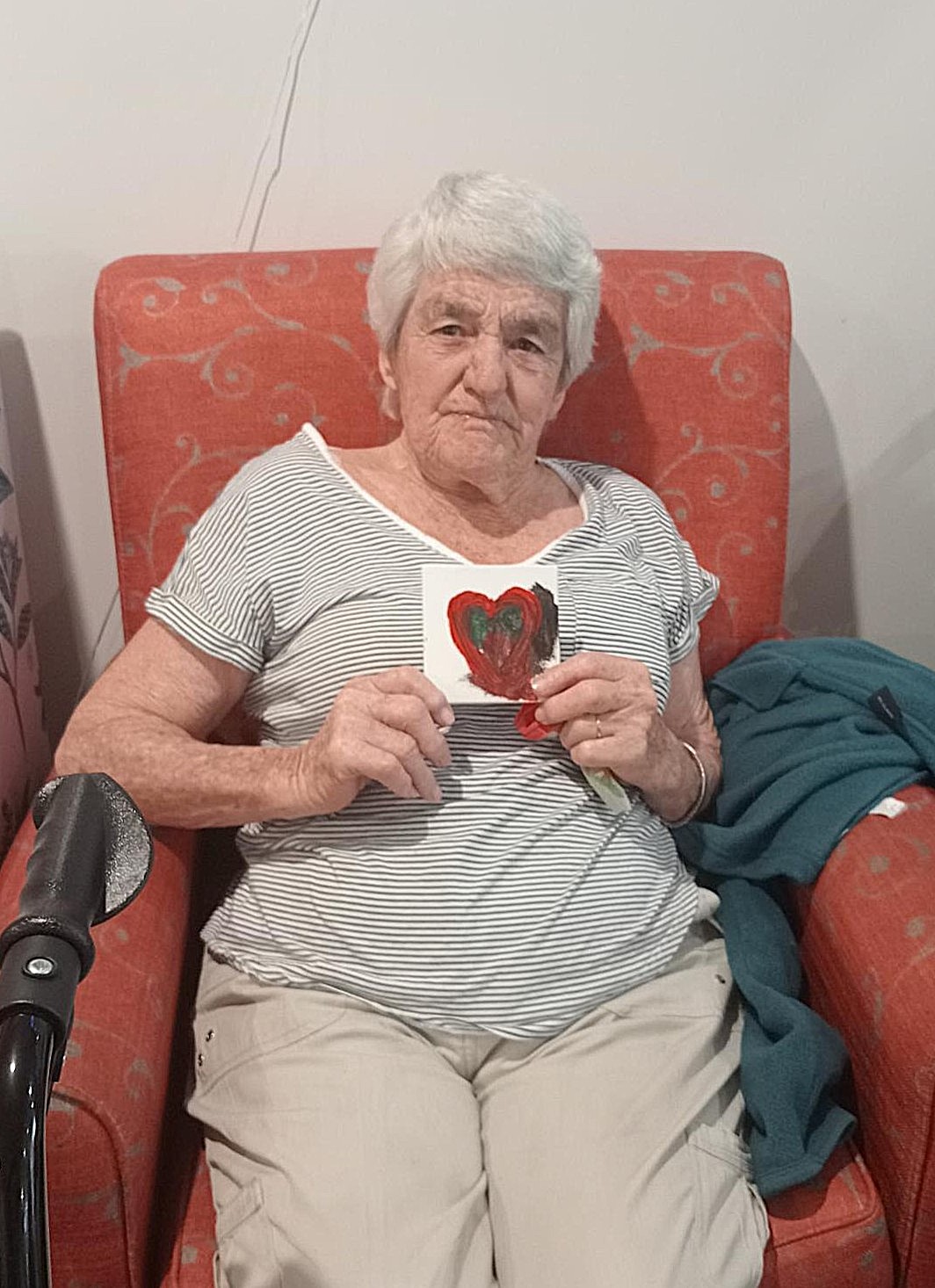 Rest home resident with her artwork